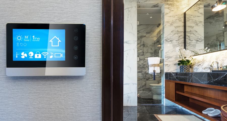 Smart home central touchscreen on wall next to bathroom